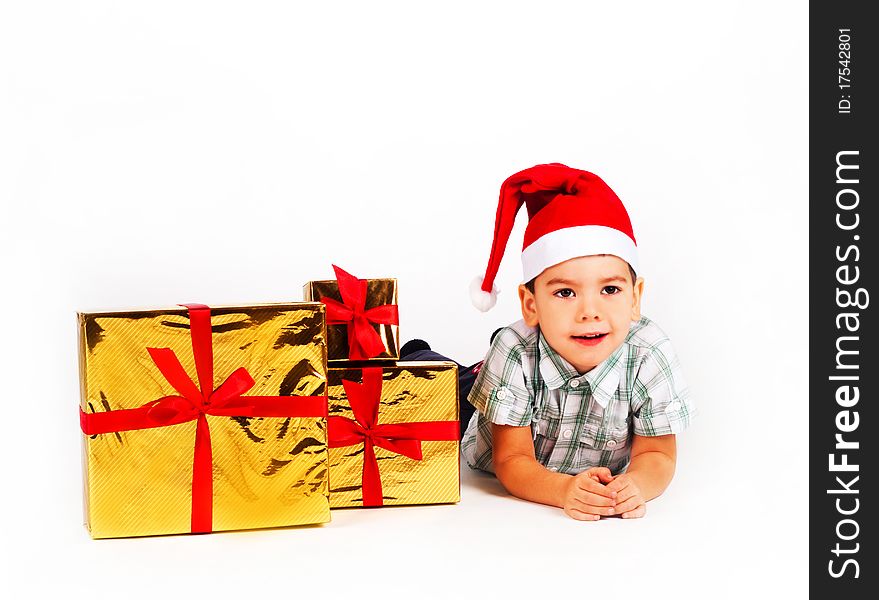 Boy In Santa Hat With A Bunch Of Gifts