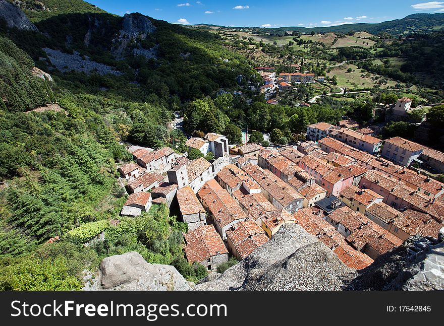 Italian landscape with a valley and a typical medieval village. Italian landscape with a valley and a typical medieval village