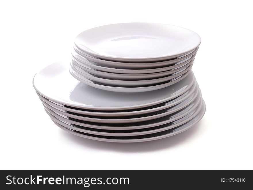 Pile of white plates on white