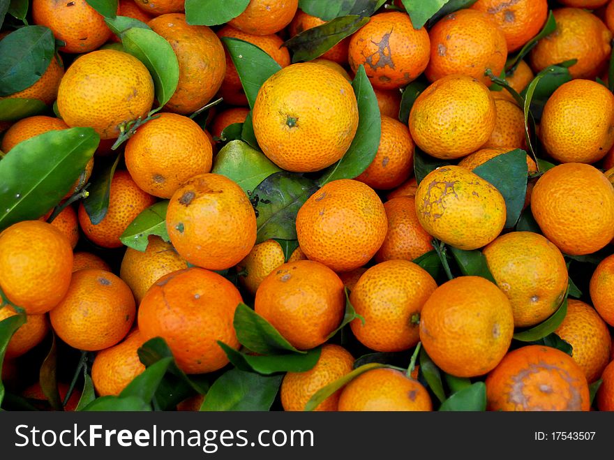 Fresh baby orange in market closeup background , Asia , Thailand