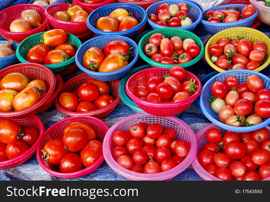 Many of fresh tomato in basket in fresh market , Asia , Thailand. Many of fresh tomato in basket in fresh market , Asia , Thailand