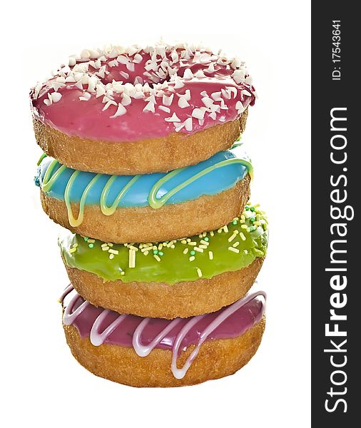 A stack of fresh decorated donuts on a white background. A stack of fresh decorated donuts on a white background.