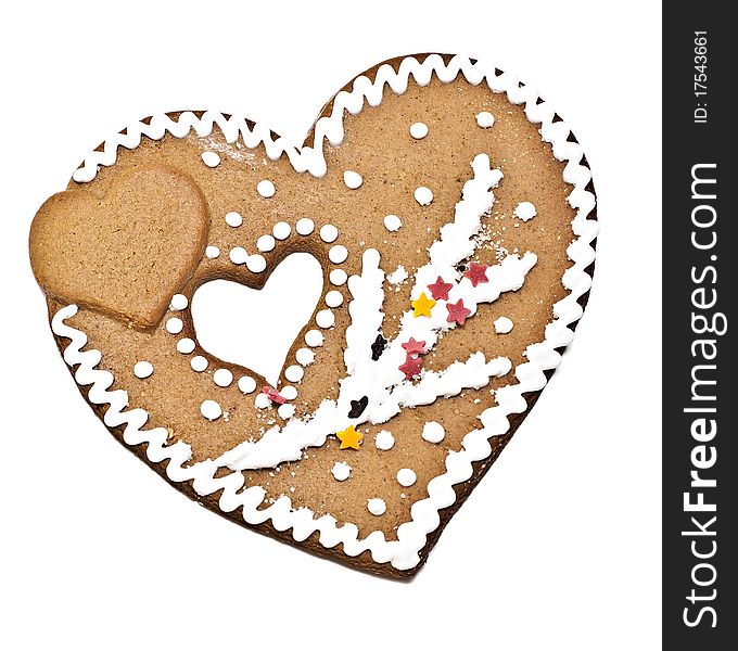 On a white background Christmas ornament gingerbread heart-shaped. On a white background Christmas ornament gingerbread heart-shaped.