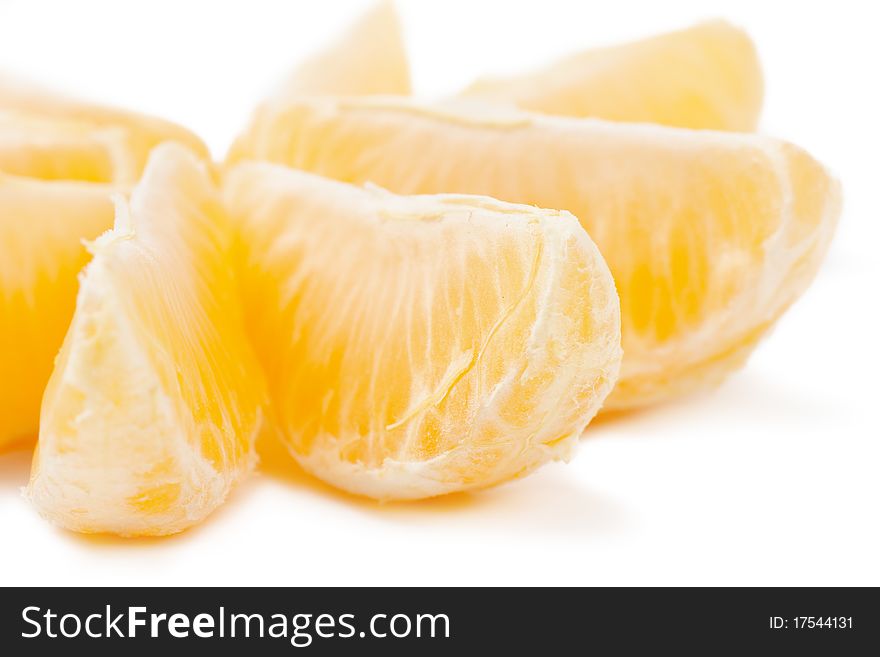 Closeup view of tangerine sections isolated on the white