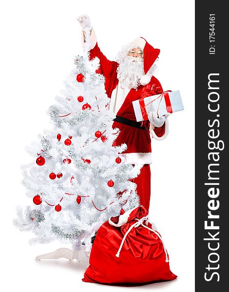 Christmas theme: Santa Claus with presents and christmas tree. Isolated over white background. Christmas theme: Santa Claus with presents and christmas tree. Isolated over white background.