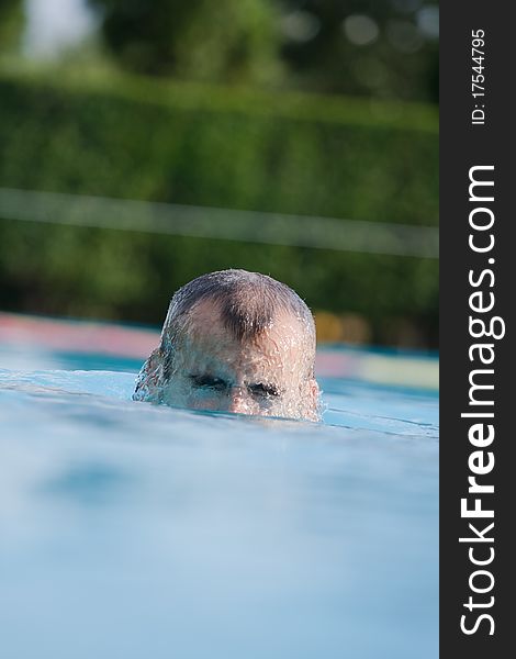 Man swimming in pool. Swim training