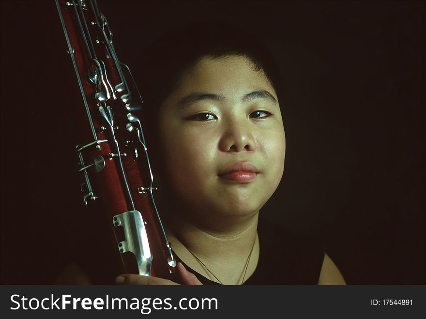 Portrait of a bassoon boy in practice