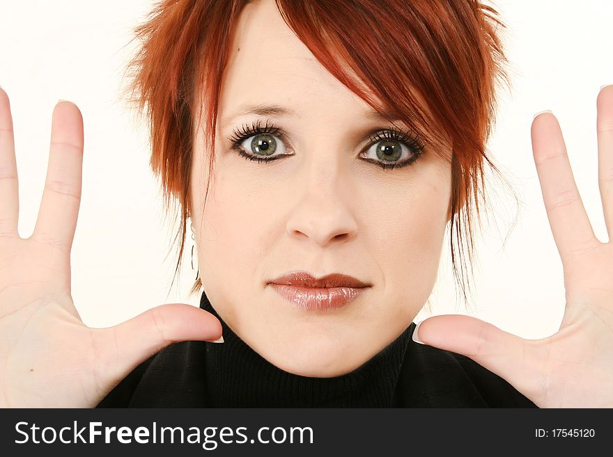 Beautiful 30 year old woman face close up with hands open to side. Beautiful 30 year old woman face close up with hands open to side.