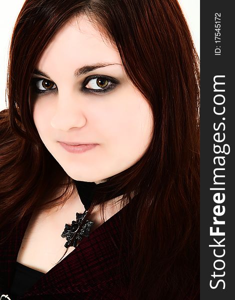 Beautiful 19 year old ginger girl close up with dark goth makeup, dark red hair, pale skin. Beautiful 19 year old ginger girl close up with dark goth makeup, dark red hair, pale skin.