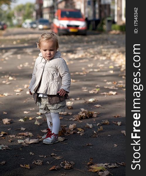 Child is playing in the street