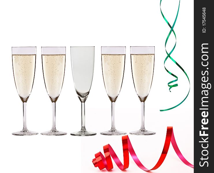 Glasses of champagne and christmas paper streamer