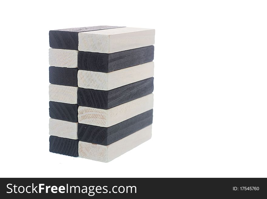 Arrangement of black and white wooden block isolated on white. Arrangement of black and white wooden block isolated on white