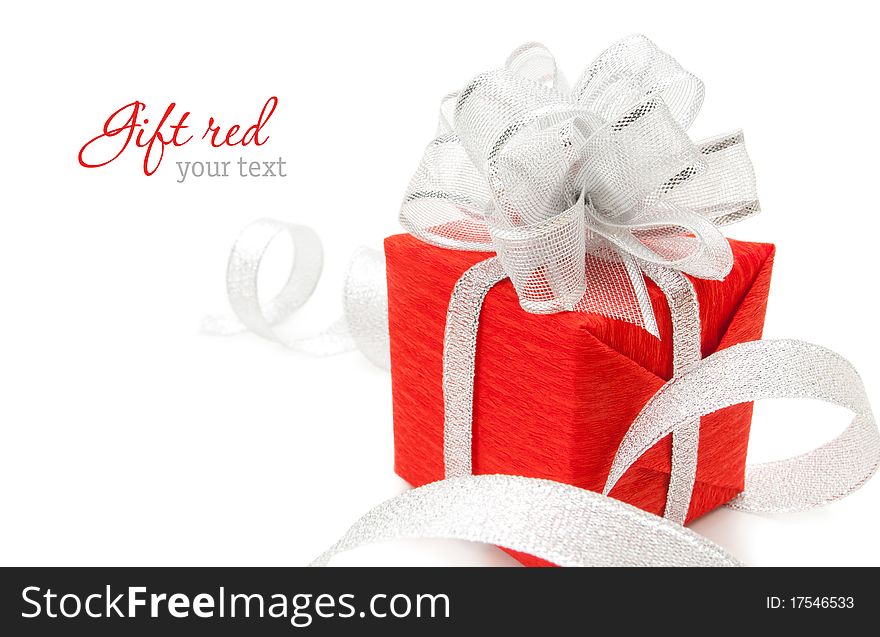 Red box with silver ribbon on white background. Copyspace. Red box with silver ribbon on white background. Copyspace