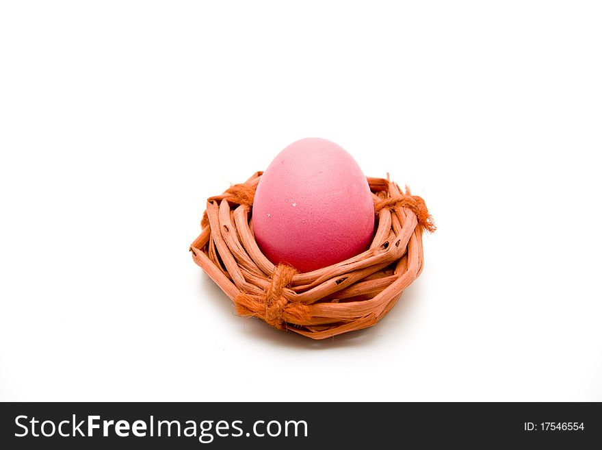 Red Easters egg with red wood wreath. Red Easters egg with red wood wreath