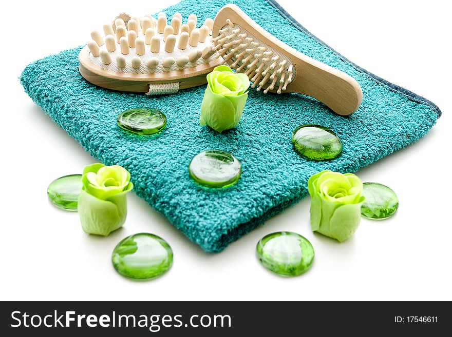 Massage brush on towel with glass stones
