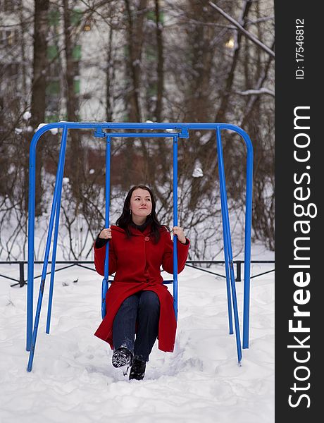 Girl on swing in winter