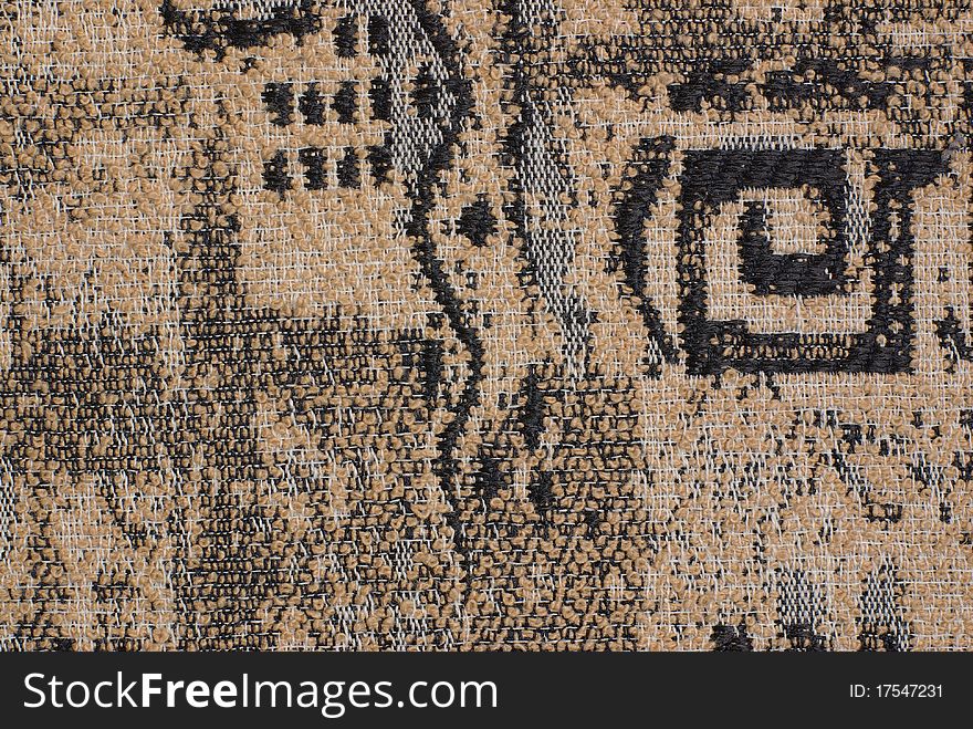 Brown fabric with an abstract black pattern