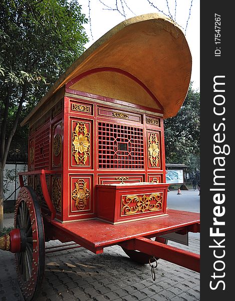 A chinese old carriage in an amusement park. A chinese old carriage in an amusement park.