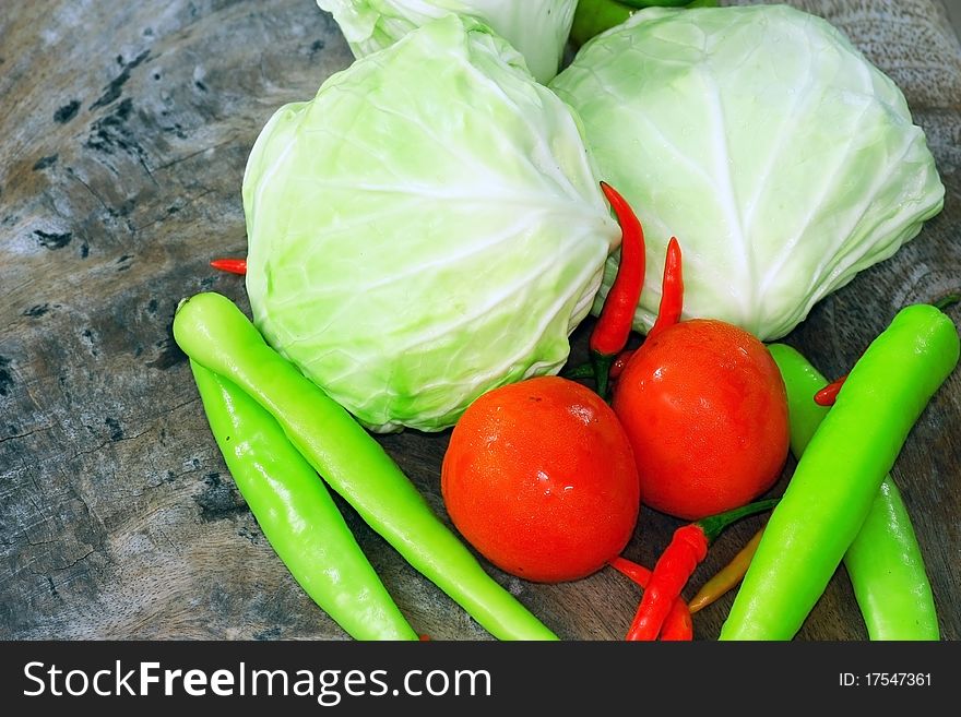 Fresh vegetables on the wood background