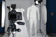 Taking Pictures Of Ghost Mannequins With Modern Clothes In Professional Photo Studio, Focus On Camera Stock Image