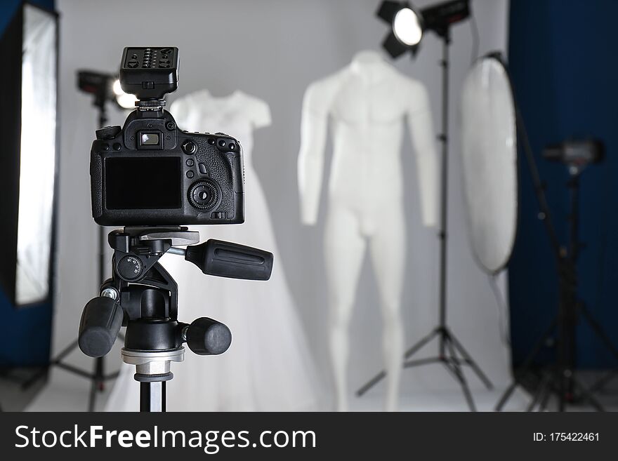 Taking Pictures Of Ghost Mannequins With Modern Clothes In Professional Photo Studio, Focus On Camera