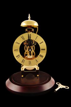 Windup Clock And Key Royalty Free Stock Images