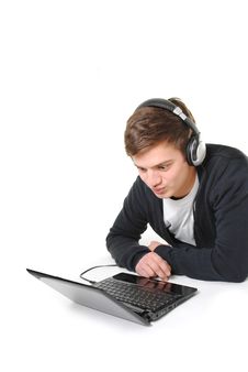 Young Man With Laptop And Headphones Royalty Free Stock Photography
