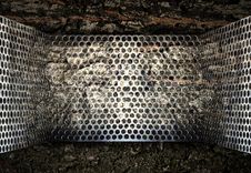 Perforated Steel Holes.on Wood Background Royalty Free Stock Photo