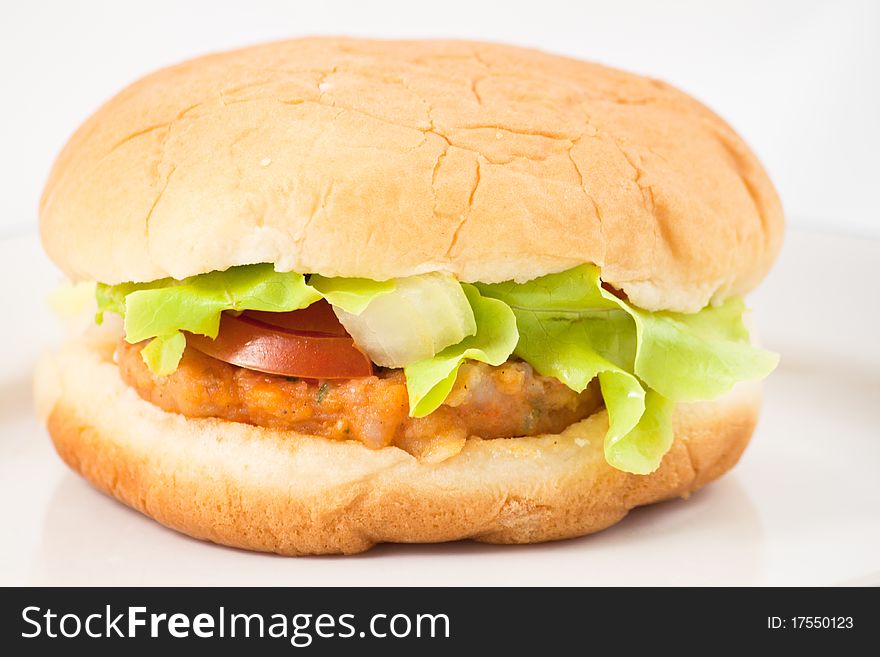 Hamburger in plate on white background