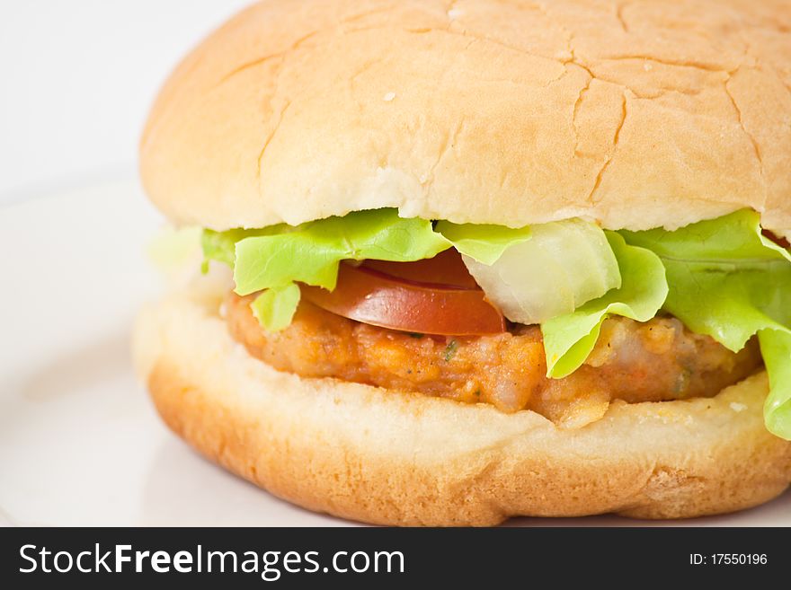 Hamburger in plate on white background