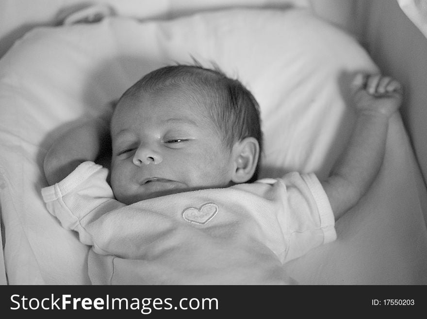 Newborn Baby Girl in the Bed