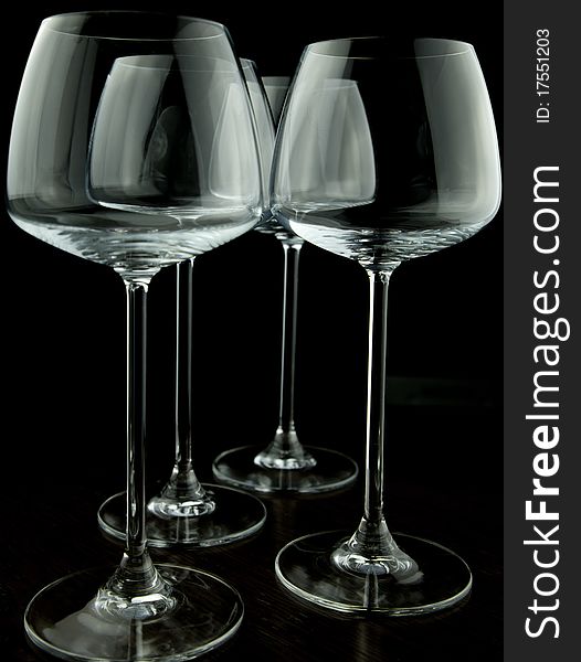 Wine glasses isolated over black background. Wine glasses isolated over black background