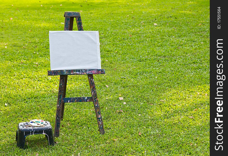 The painting board on fresh green grass. The painting board on fresh green grass