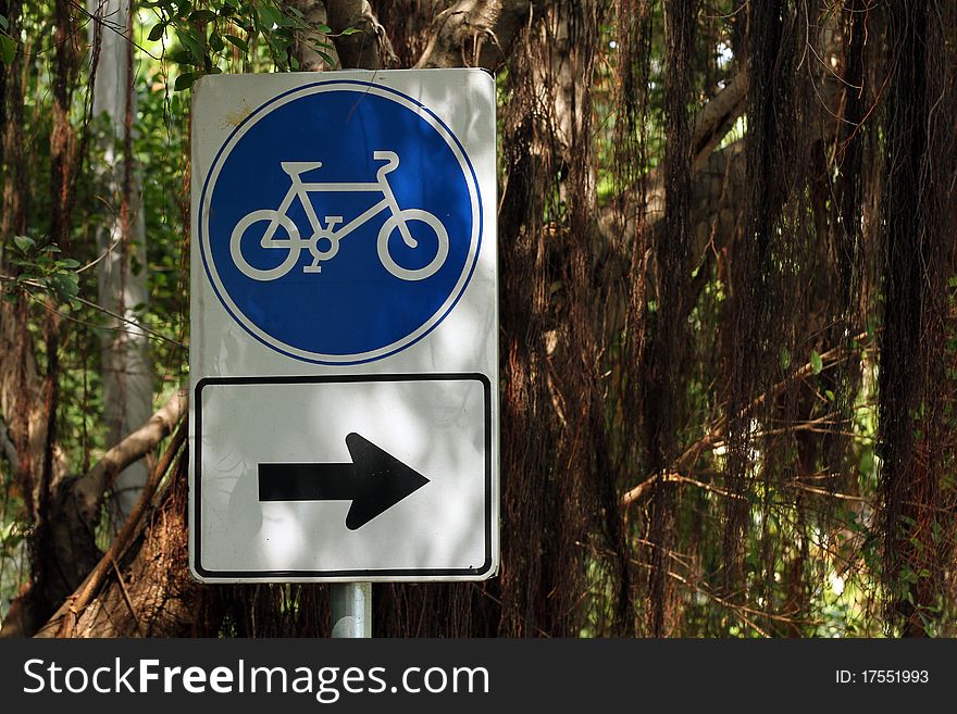 The bicycle sign in the park.