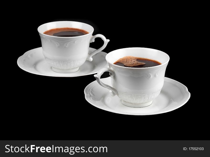 Coffee for two, isolated on black surface