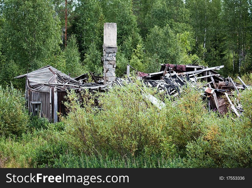 A collapsed old house at summertime. A collapsed old house at summertime.