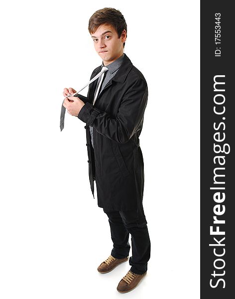 Funny young man adjusting his tie, isolated on a white background. Funny young man adjusting his tie, isolated on a white background