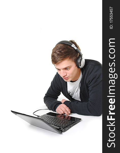 Happy young man browsing for music on the internet. Happy young man browsing for music on the internet