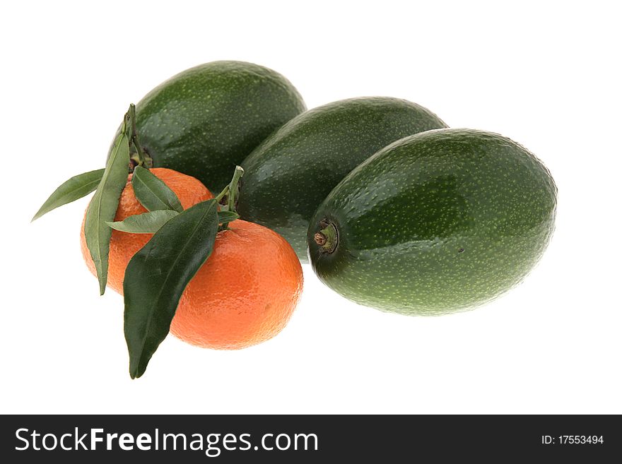 Three avocados and two tangerines on a white background. Three avocados and two tangerines on a white background