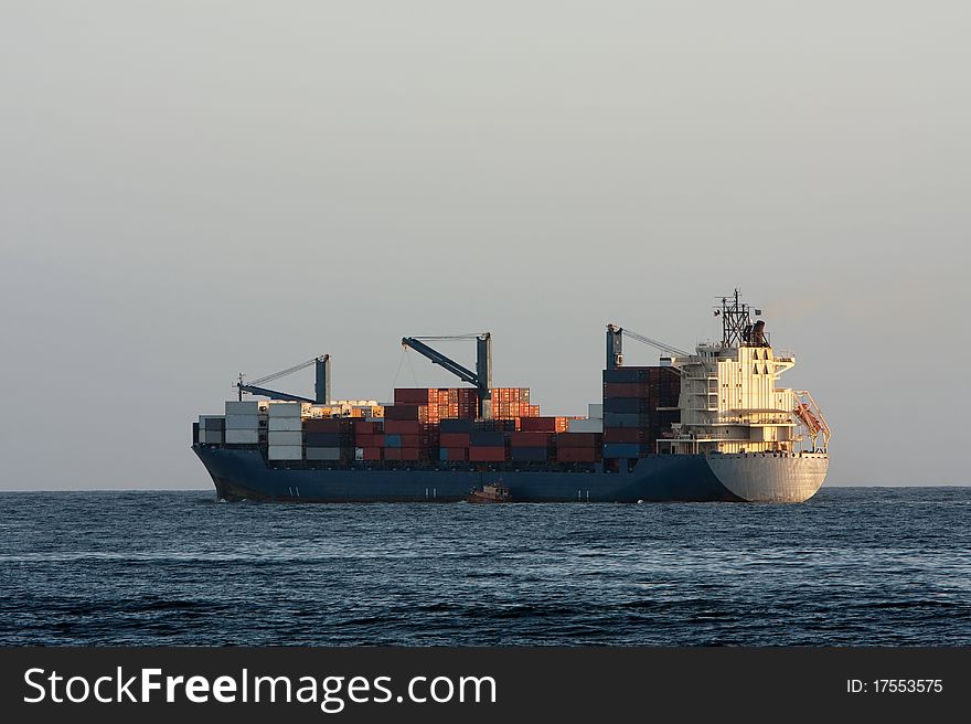 Container Cargo Ship At Sea.