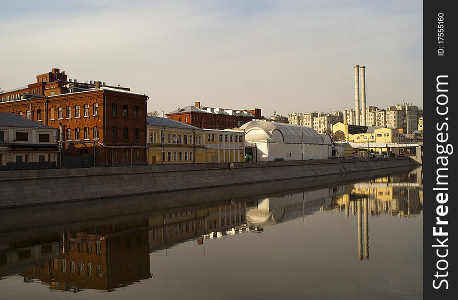 Moscow river and former buildings of the red October factory reflecting in it. Moscow river and former buildings of the red October factory reflecting in it