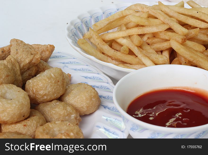 Fired meat ball and French fries.