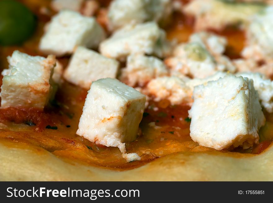 Cheese pizza with olives close