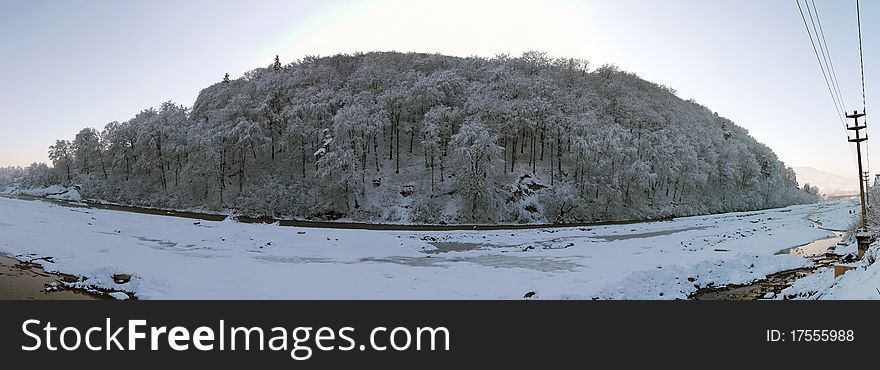 A panorama to a hill and river frozen. A panorama to a hill and river frozen.