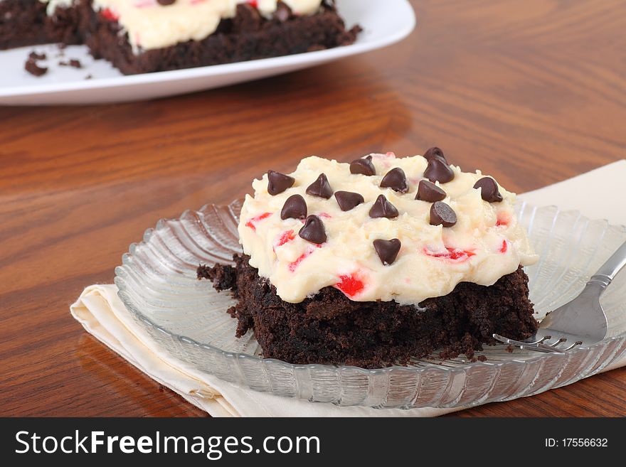 Cherry cheesecake chocolate brownie topped with sprinkles. Cherry cheesecake chocolate brownie topped with sprinkles