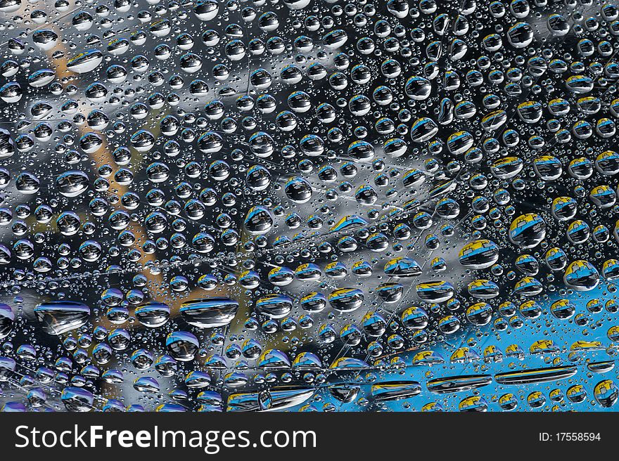 Background with color water drop. Rain drop on the glass