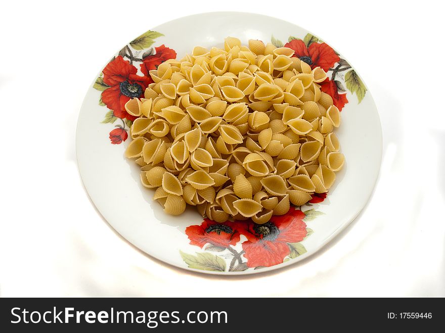 Dry vermicelli in a plate on a white background. Dry vermicelli in a plate on a white background.