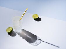 A Glass Of Fresh  Lime Lemonade On A Gray Blue Background With Hard Shadows Royalty Free Stock Photos