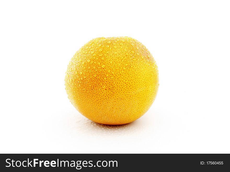 Grapefruit with drops on a white background