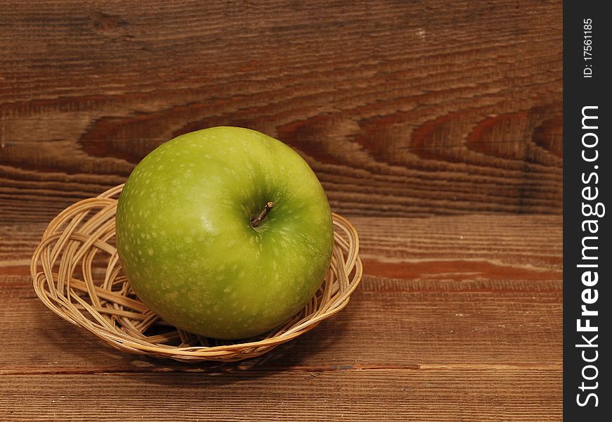 Ripe apple in basket